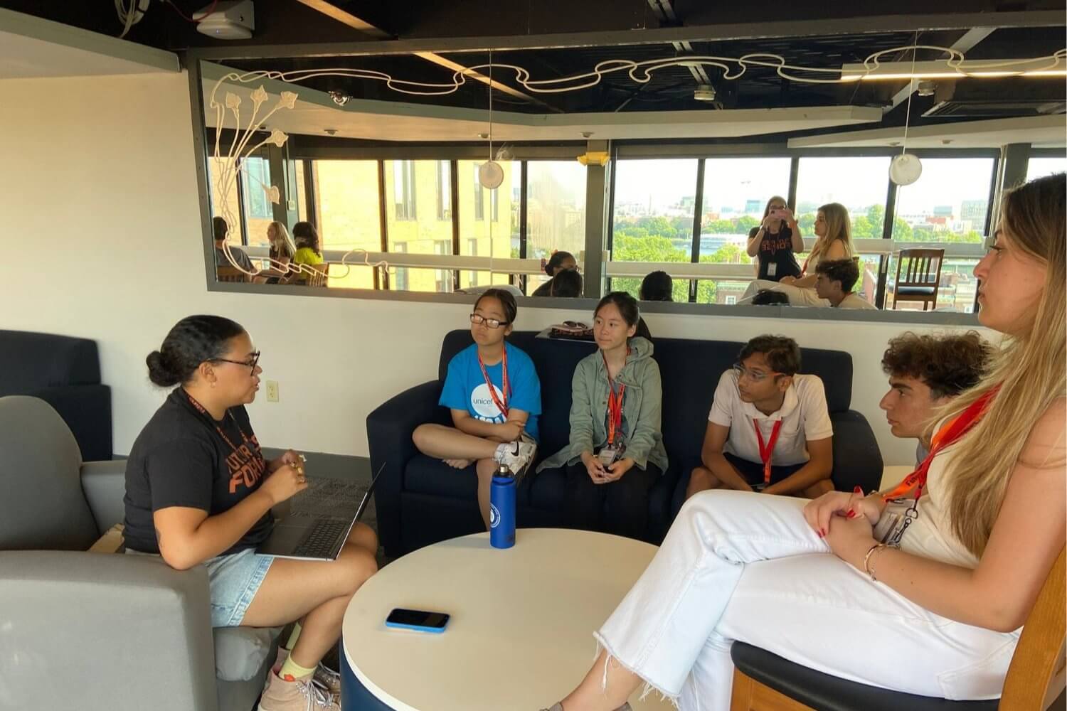 students engaging in a group discussion during a summer program at Futures Forge for high school students.