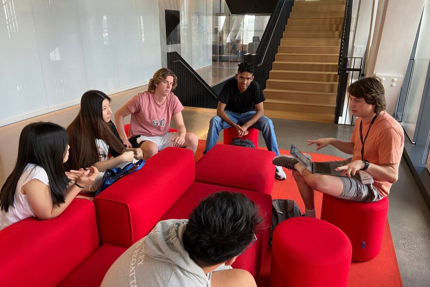 High school students engaging in a group discussion during a summer program at Futures Forge.