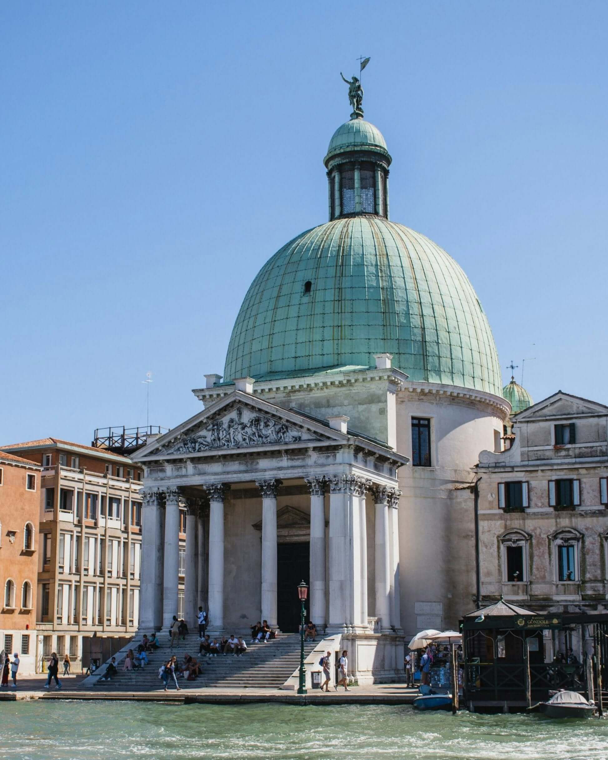 Historic building with a green dome in Venice, a must-see on your Northern Italy adventure for student travel.