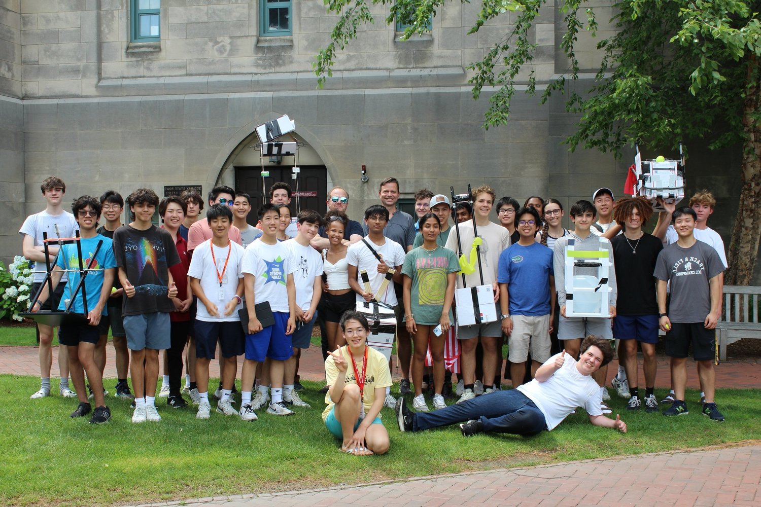 Group of high school students showcasing projects at a summer program focused on skills for success.