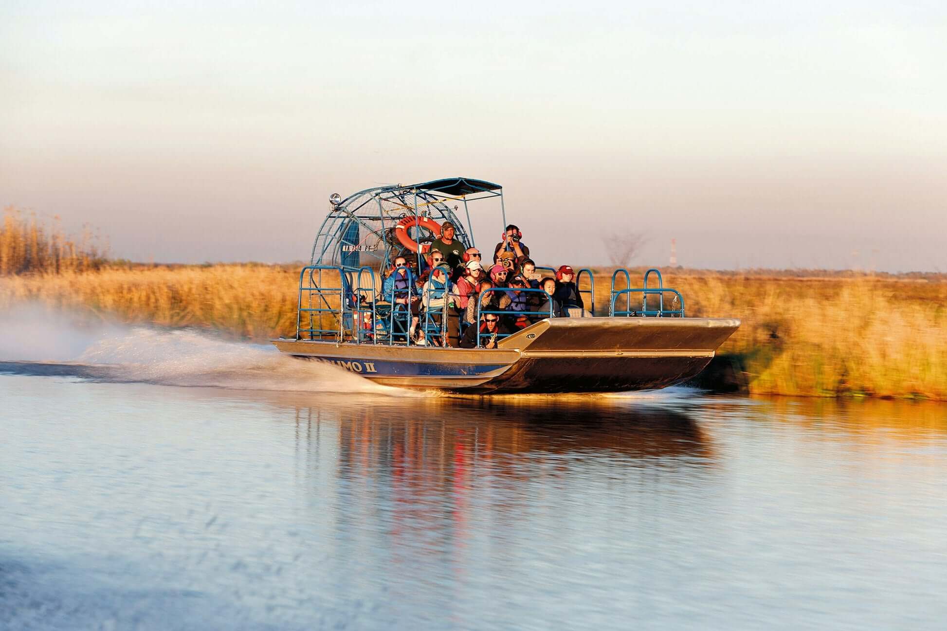 Airboat tour in New Orleans showcasing adventure in the bayou with an enthusiastic group exploring nature.