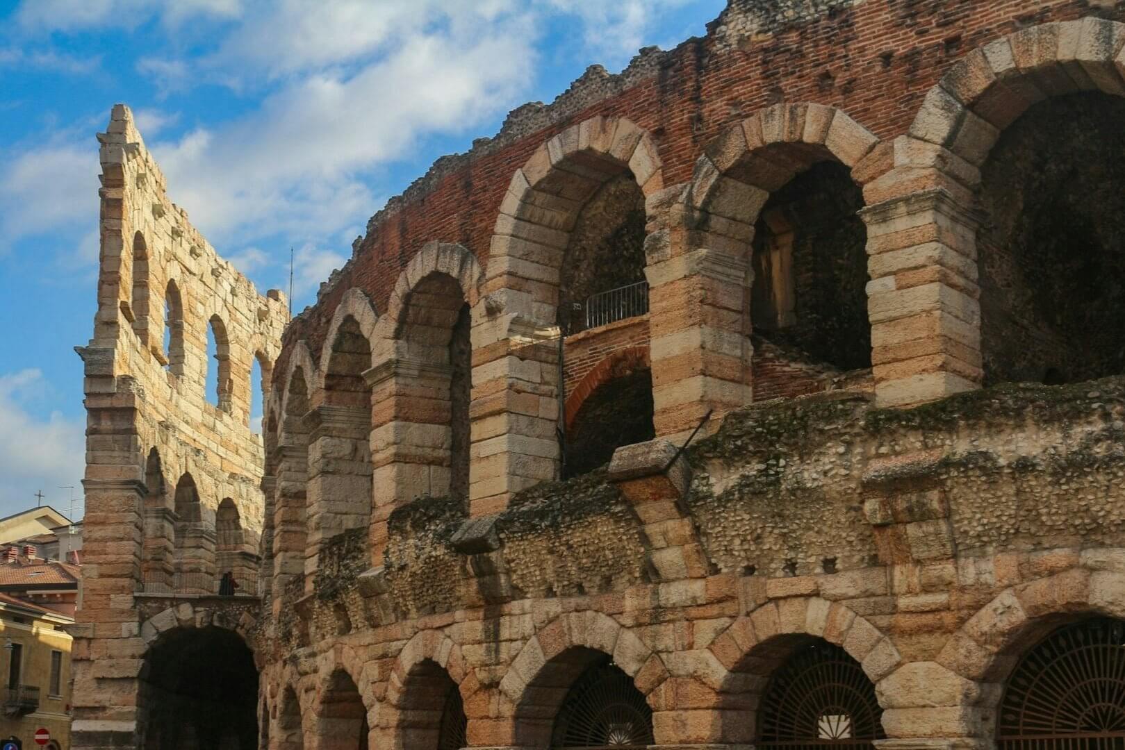 Ancient Roman amphitheater showcasing grand arches in Verona, Italy, perfect for student travel adventures.