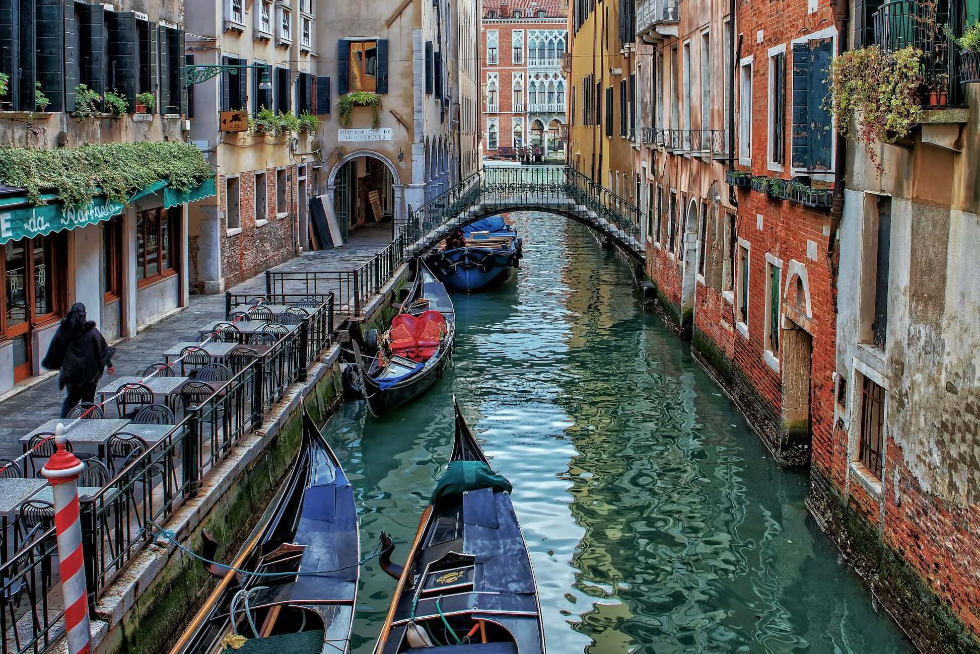 serene canal scene in Venice with gondolas, charming architecture, and a peaceful atmosphere, perfect for student travel adventures.